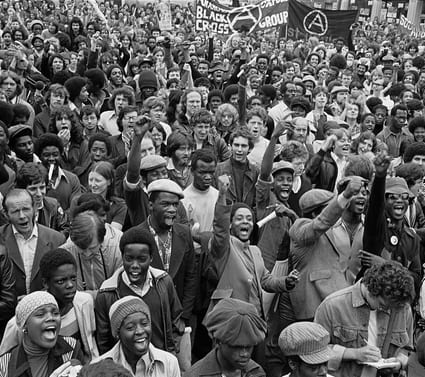 Paul Trevor, Anti-racists gather to block route of National Front demonstration, New Cross Road, London, August 1977 © Paul Trevor