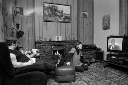 Keith Pattison, Brian, Paul and Denice Gregory watching Channel Four News. Cuba Street. Easington Colliery. County Durham. November 1984. The mainstream media found an easy hate figure in Arthur Scargill and mauled mining communities, portraying them as being gullible and duped, lawless and intimidatory. Everything Scargill predicted came to pass, and more. Before the internet and multiple sources of news, Channel Four stood out as a beacon of decent reporting. © Keith Pattison